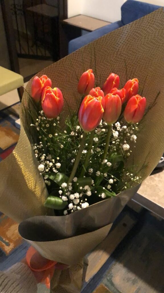 a bouquet of flowers in a paper wrapper