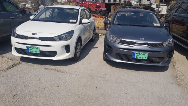 two cars parked on a street