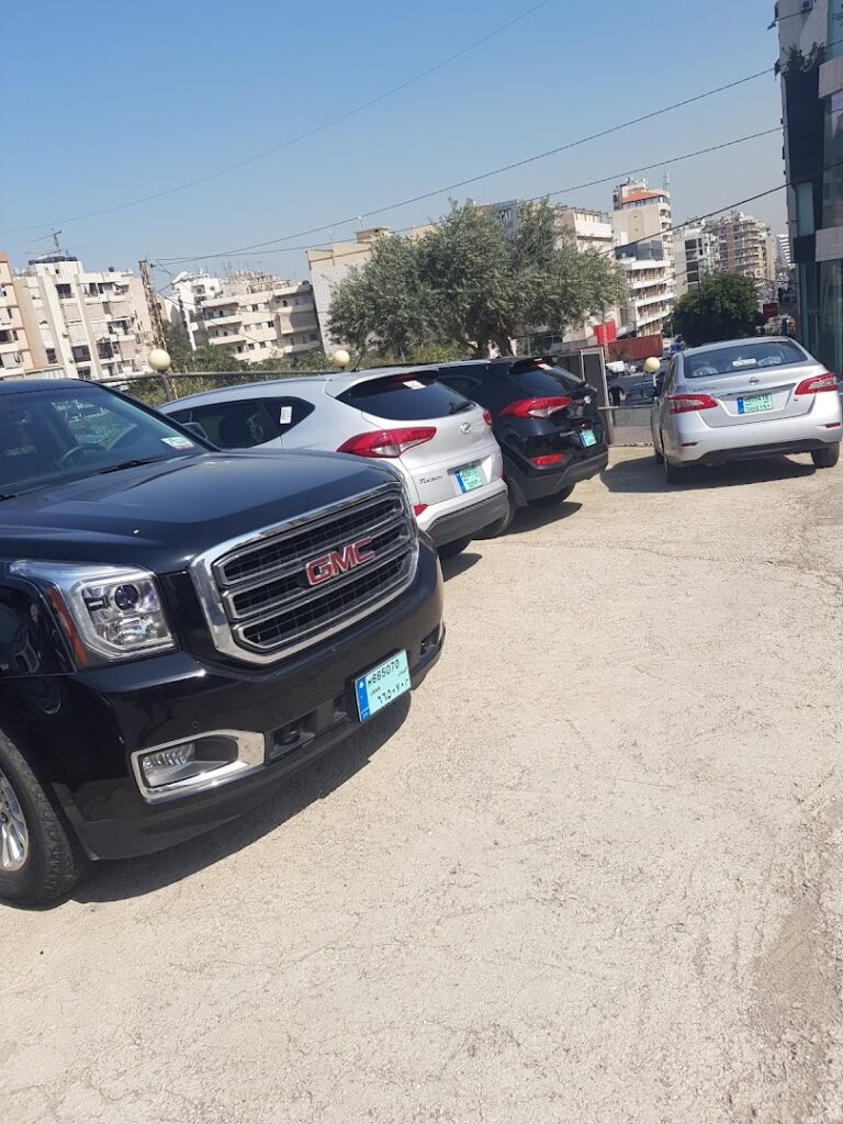 a group of cars parked in a parking lot