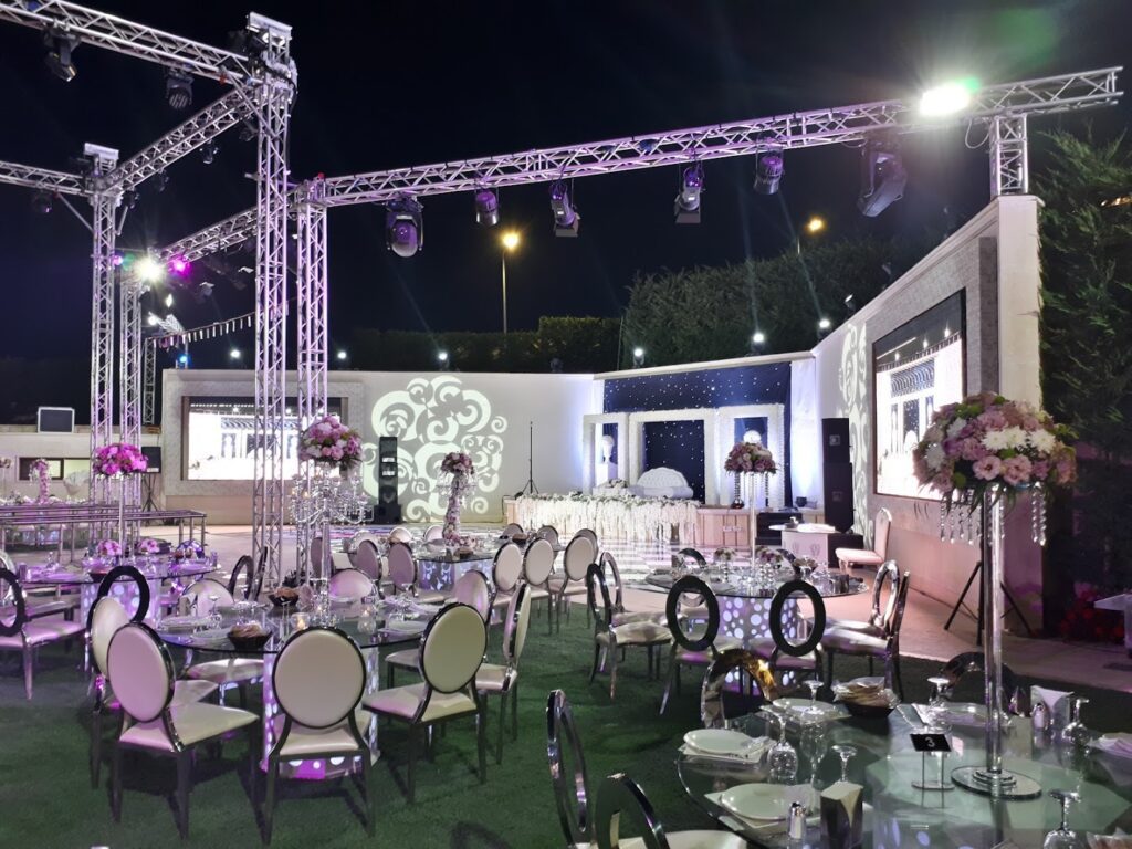 a large outdoor event with tables and chairs