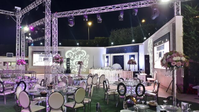 a large outdoor event with tables and chairs