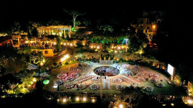 an aerial view of a courtyard with tables and chairs