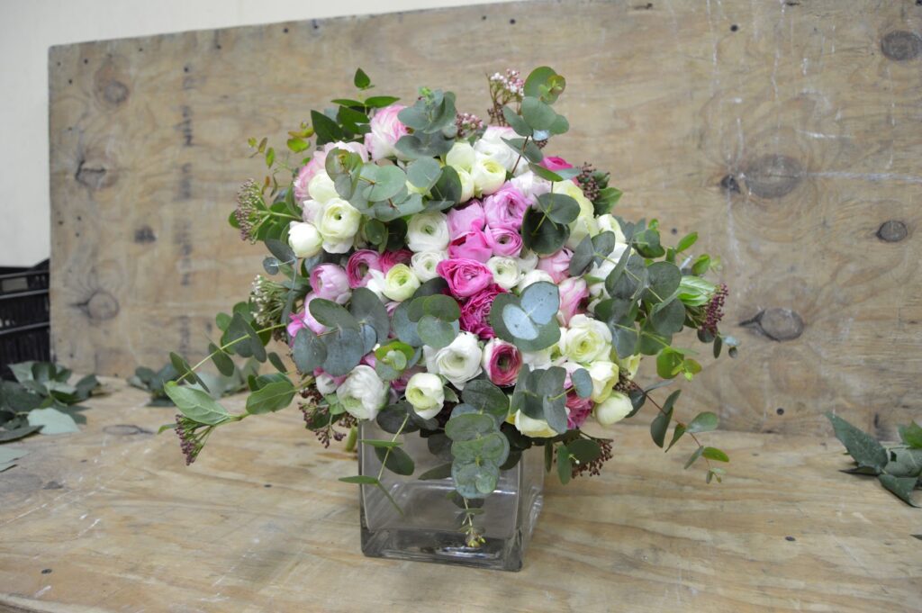 a bouquet of flowers in a glass vase