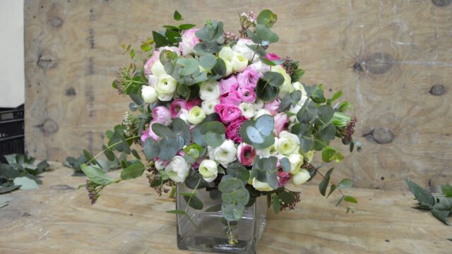 a bouquet of flowers in a glass vase