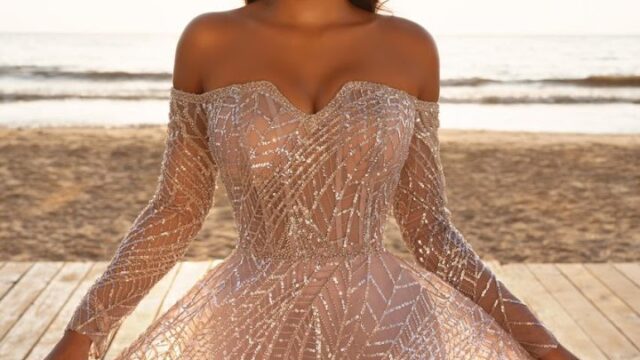 a woman in a dress on a beach