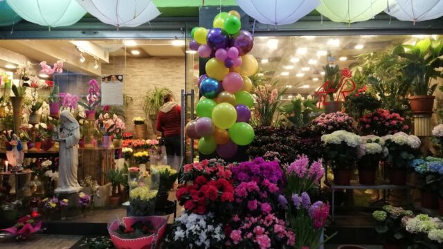 a store with flowers and balloons