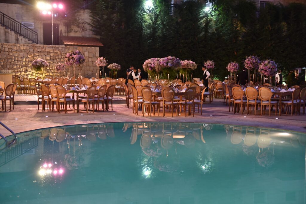 a pool with tables and chairs