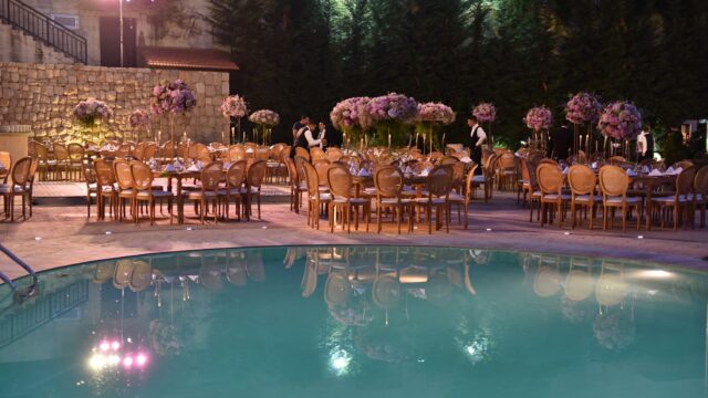 a pool with tables and chairs