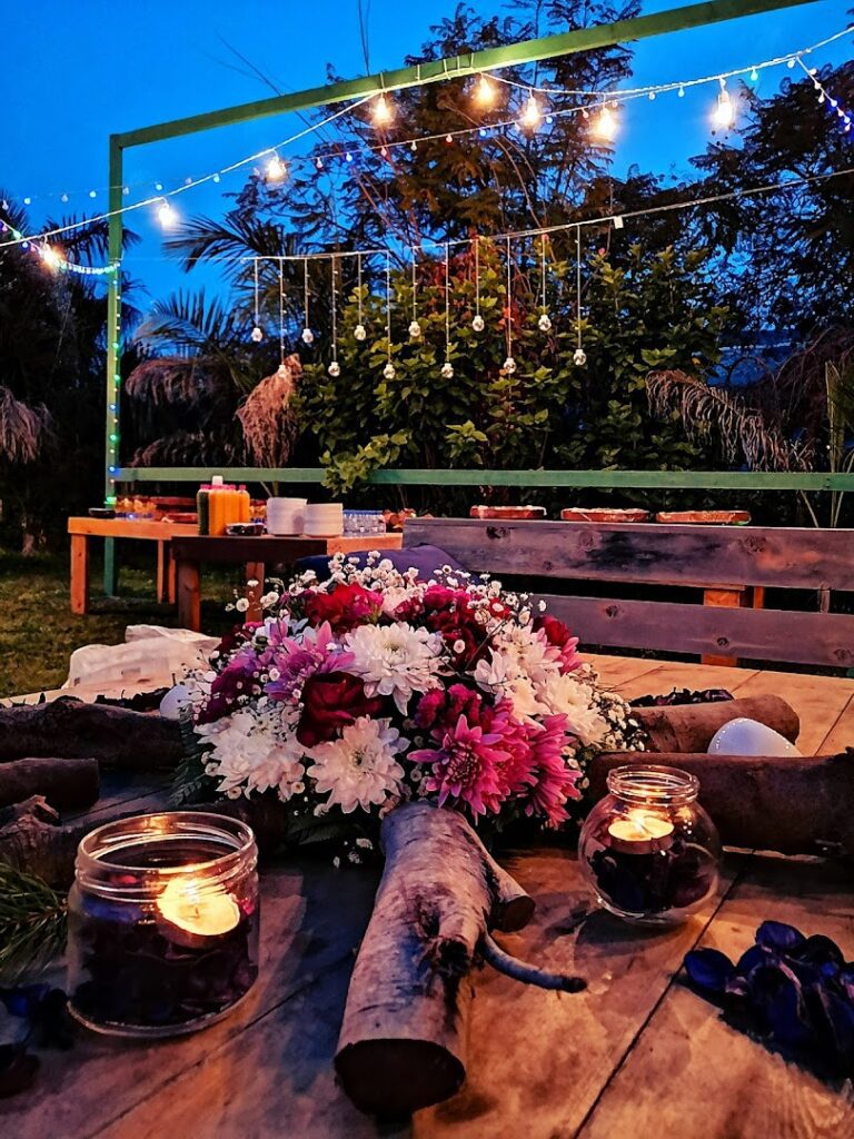 a table with flowers and candles on it