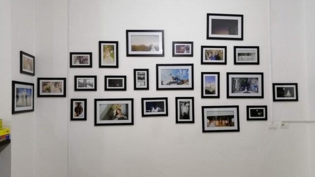 a wall with pictures on it