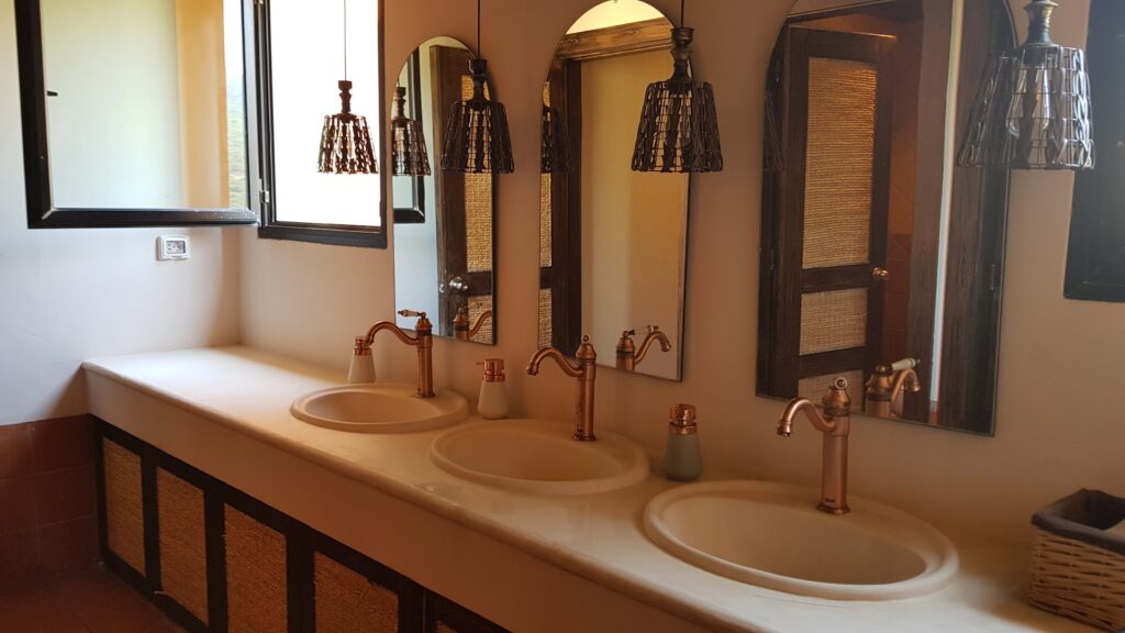 a bathroom with sinks and mirrors