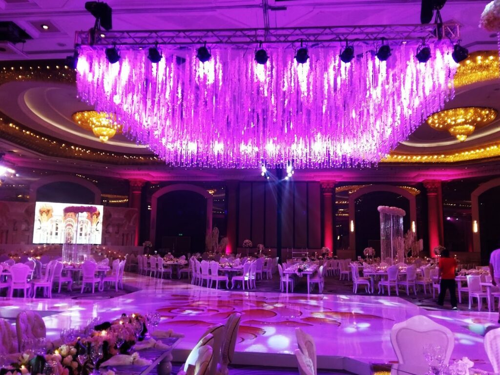 a large ballroom with purple lights