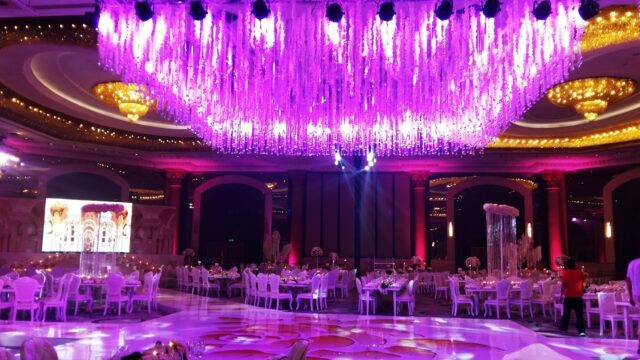 a large ballroom with purple lights