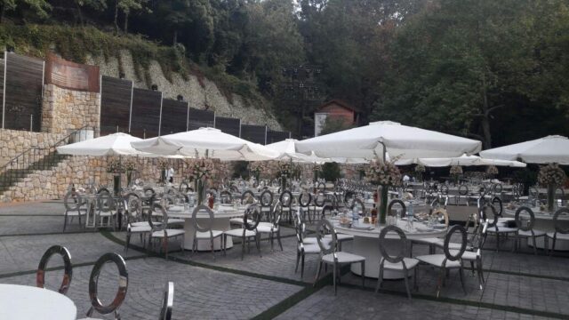 a group of tables and chairs outside