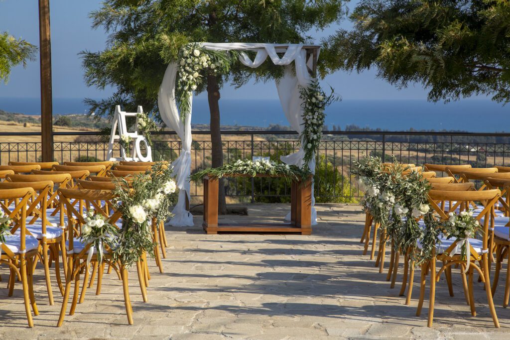 a wedding ceremony set up with chairs and flowers