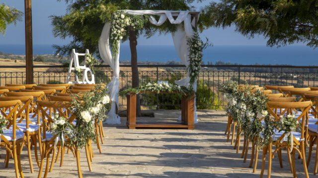 a wedding ceremony set up with chairs and flowers