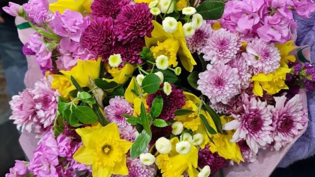 a person holding a bouquet of flowers