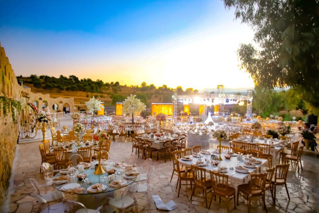 a large outdoor event setting with tables and chairs