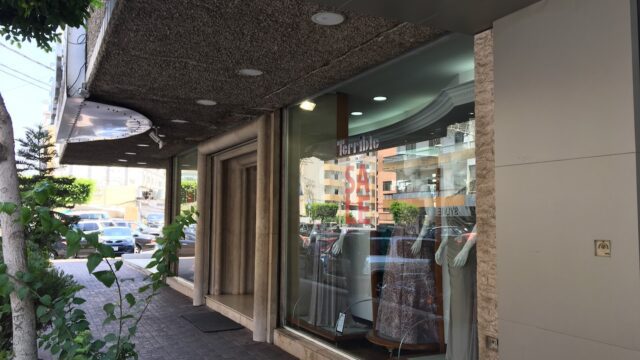 a storefront with a sign on the window