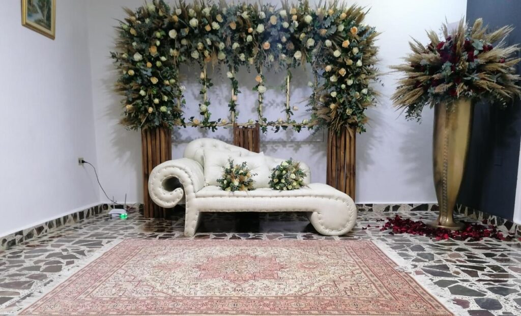 a white couch with flowers on it