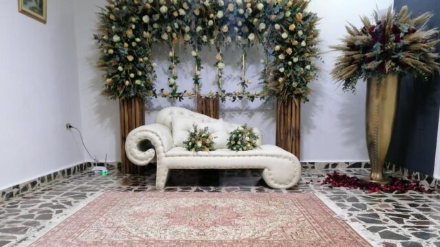 a white couch with flowers on it