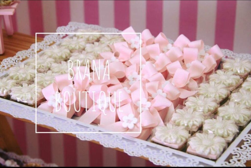 A tray of pink and white bows featuring Brana.