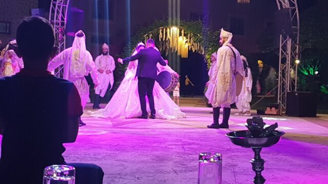 a group of people dancing on a stage