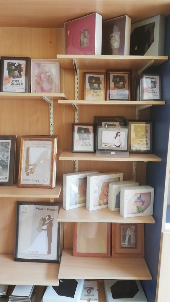 a shelf with pictures on it