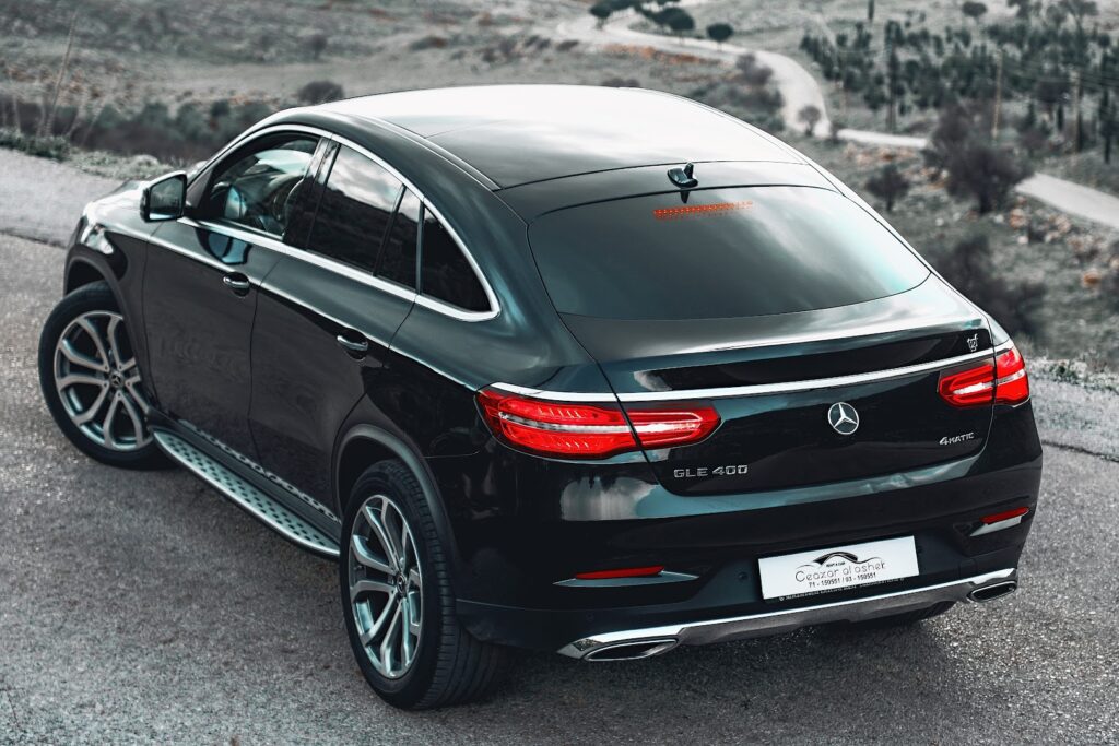 a black car parked on a road