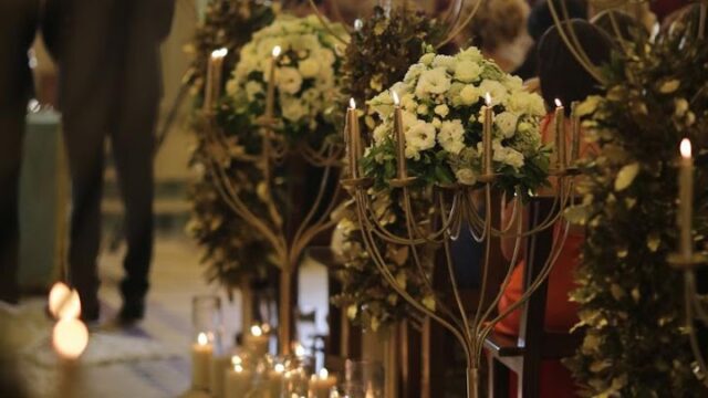 a group of candles and flowers