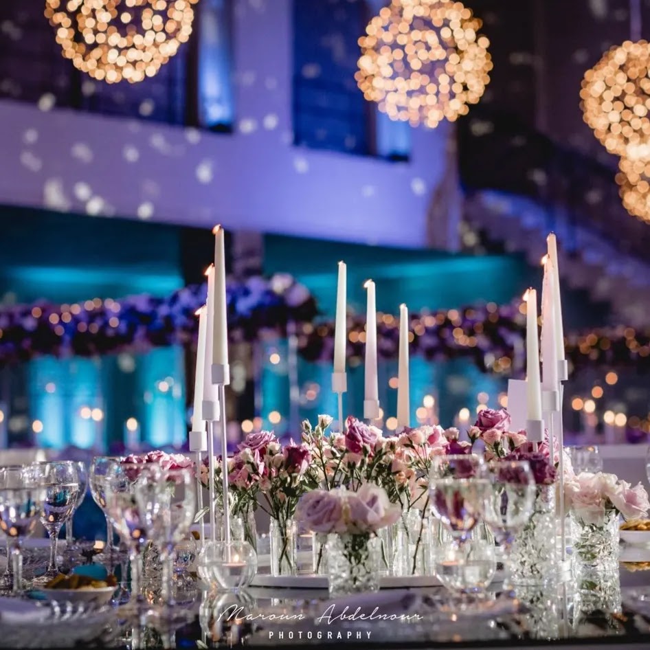 a table with flowers and candles