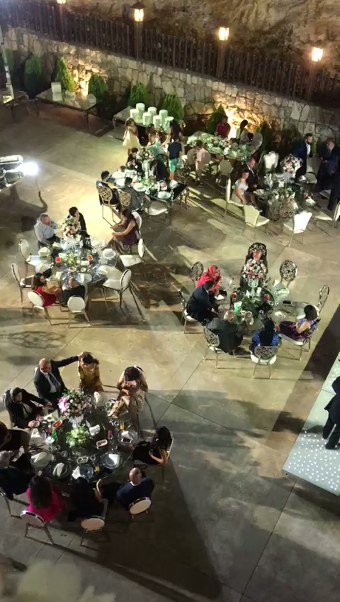 a group of people sitting around tables