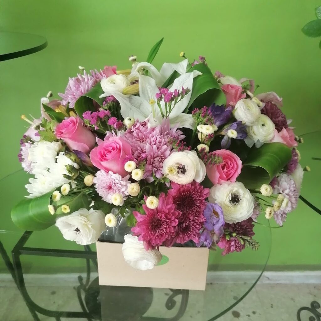 a bouquet of flowers on a glass table