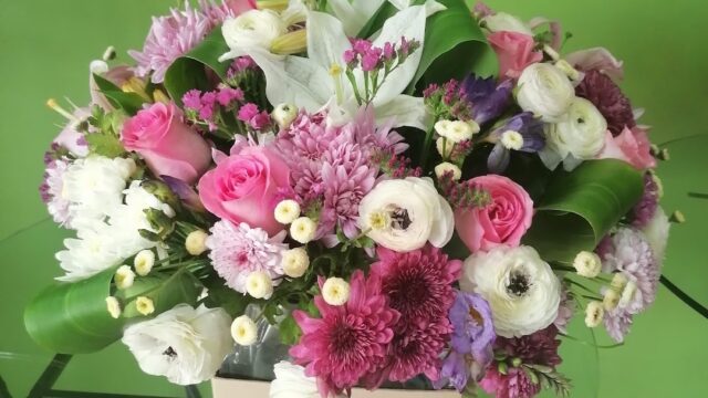 a bouquet of flowers on a glass table