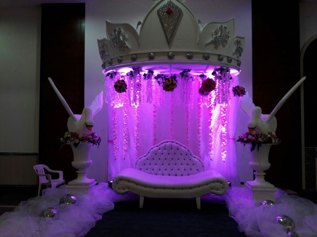 a stage with a crown and a couch
