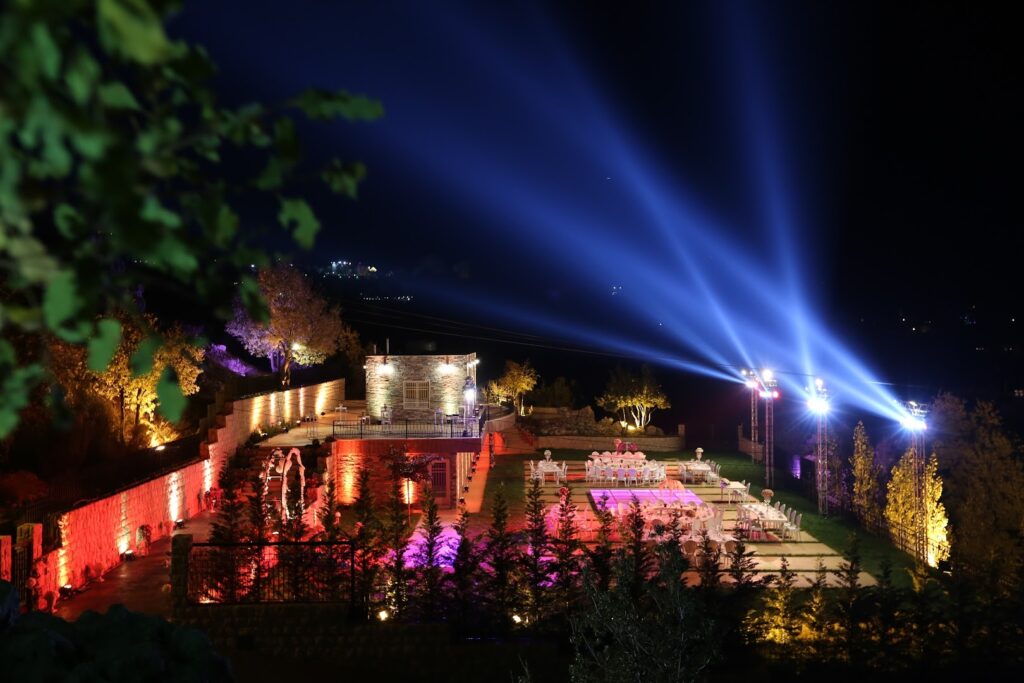 a lit up area with tables and chairs