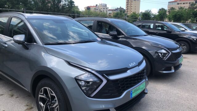 a group of cars parked in a parking lot