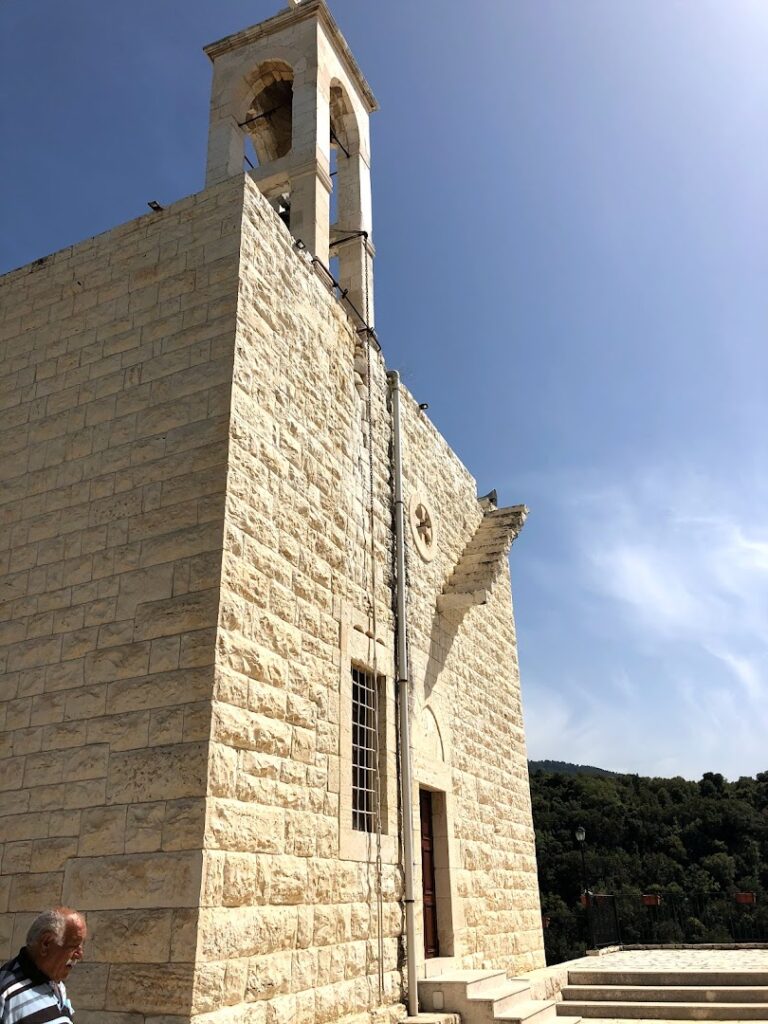 a stone building with a bell tower