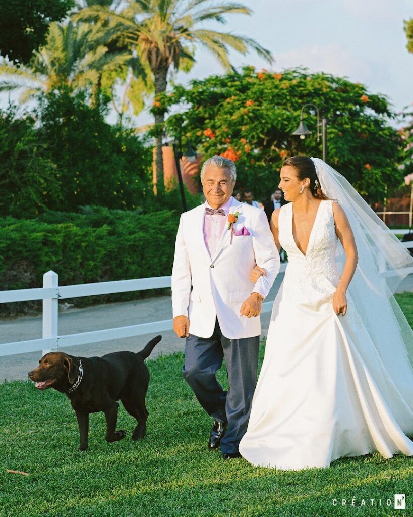 a man and woman walking a dog