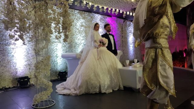 a man in a suit and woman in a wedding dress