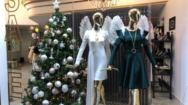 a mannequins in a store with angel wings