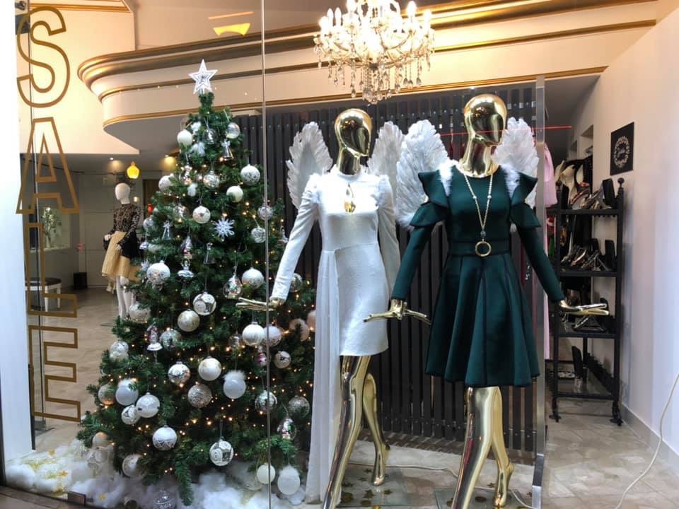a mannequins in a store with angel wings