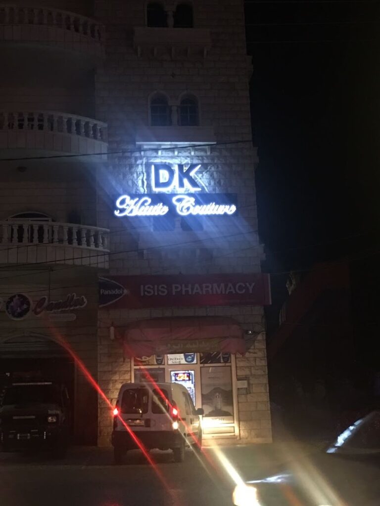 a building with a sign on it at night