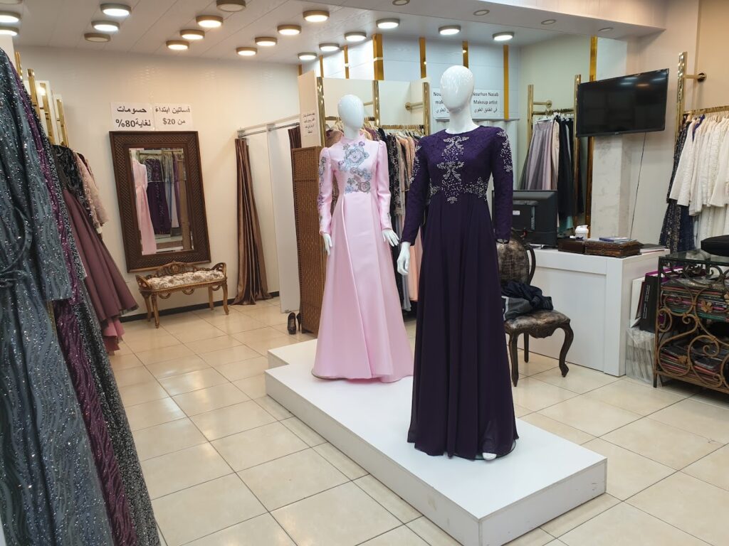 mannequins in a store with dresses on display