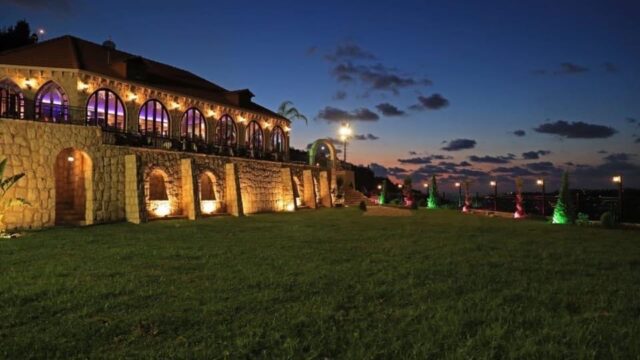 a building with lights on the side of it