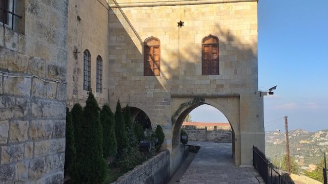 a stone building with a gate