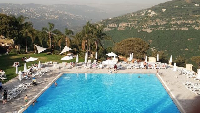 a pool with people around it