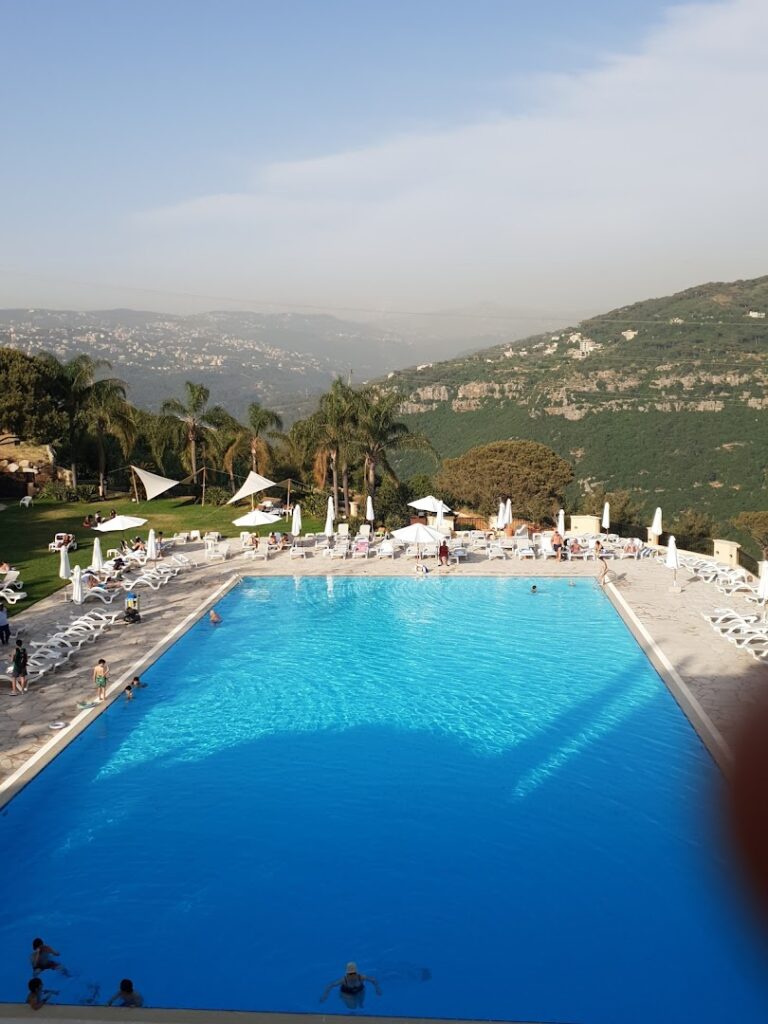 a pool with people around it