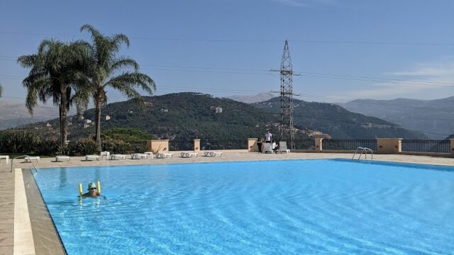 a pool with a couple of people in it