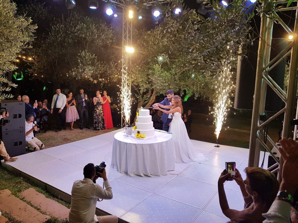 a couple cutting a cake at a wedding